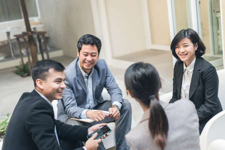 young asian business team discuss at the outdoorの写真素材