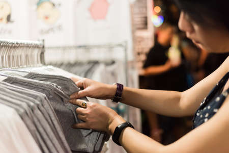 asian woman shopping at the night market in bangkokの写真素材
