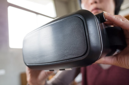 mature woman using vr headset in the house