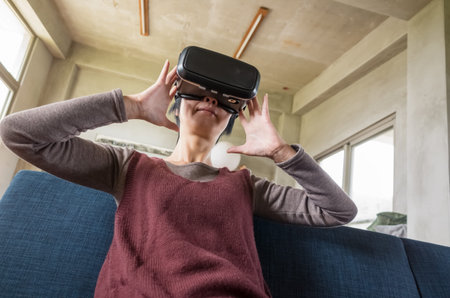 mature woman using vr headset in the house