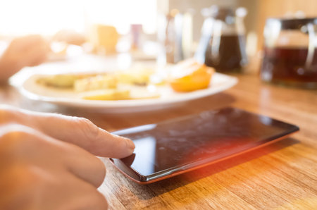 woman using smartphone, close-up image with handの写真素材