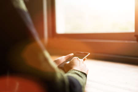 woman using smartphone, close-up image with handの写真素材