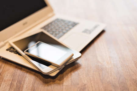 phone and tablet on a laptop, closeup imageの写真素材
