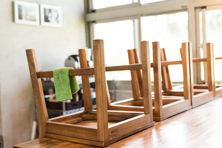 put wooden chairs on the desk and cleaning