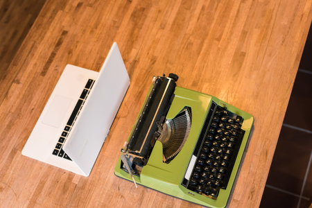 old typewriter and laptop on the tableの写真素材