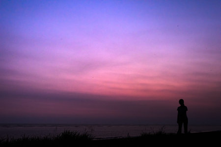 silhouette of young woman walk at night