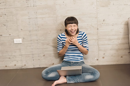 happy girl use a laptop at home, concept of working in the house