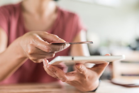 woman using a credit card, concept of payment or shoppingの写真素材