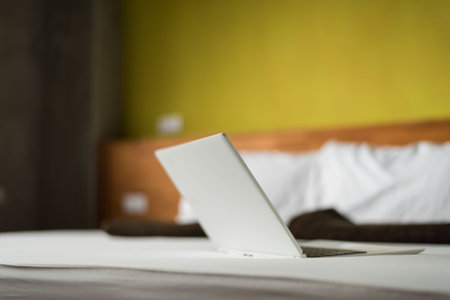 laptop on the bed, concept of working at homeの写真素材