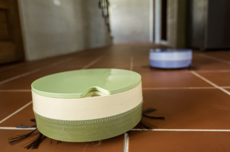 robotic vacuum cleaner working at home on the ground