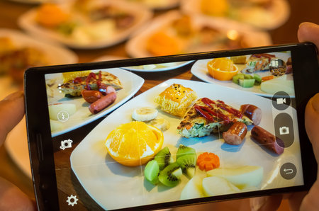 taking photo at morning breakfast on table