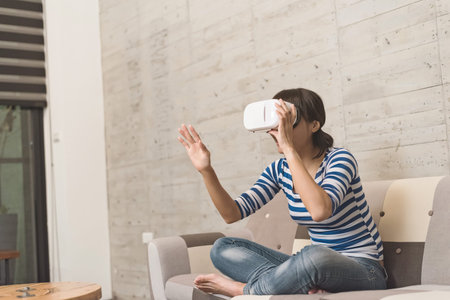 Asian woman using vr headset at home