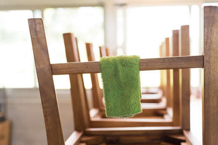 put wooden chairs on the desk and cleaningの写真素材