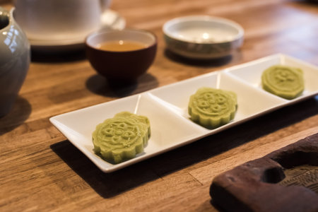 green mooncake on table at Chinese Mid Autumn Festival