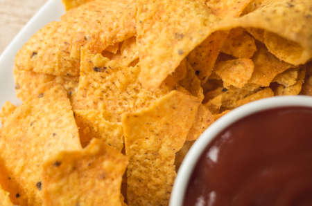 yellow mexican nachos chips on the tableの写真素材