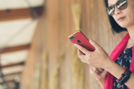 woman using cellphone at the corridor at the station