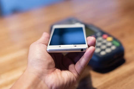 using a credit card machine, concept of payment or shoppingの写真素材