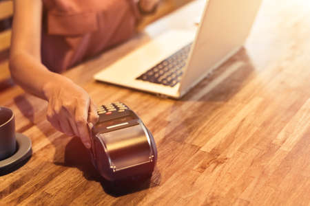 woman using a credit card, concept of payment or shoppingの写真素材