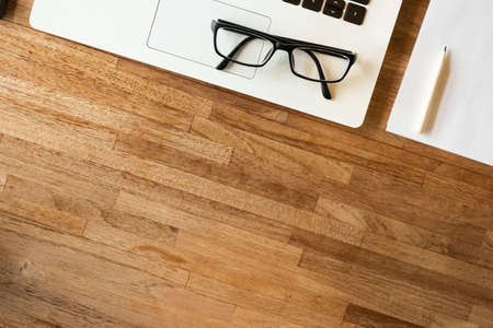 glasses on the notebook on the table, concept of plan, business, workingの写真素材