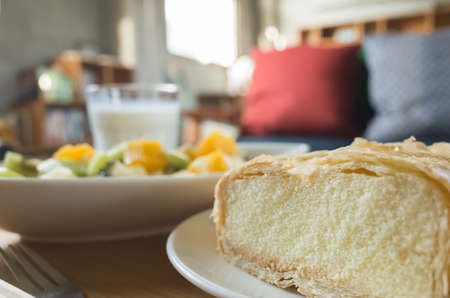 breakfast with milk, fruit and cake at morningの写真素材