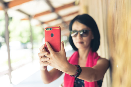 woman take a selfie at the corridor at the station