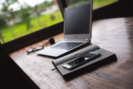 phone on the notebook on the table, concept of plan, business, workingの写真素材