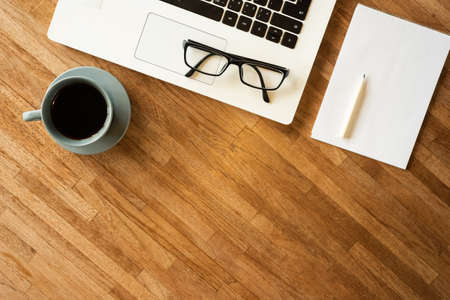 glasses on the notebook on the table, concept of plan, business, workingの写真素材