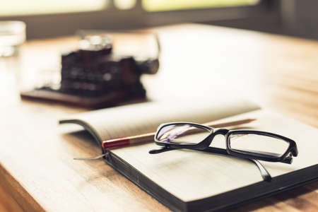 notebook with typewriter on the table with nobody, concept of working at homeの写真素材