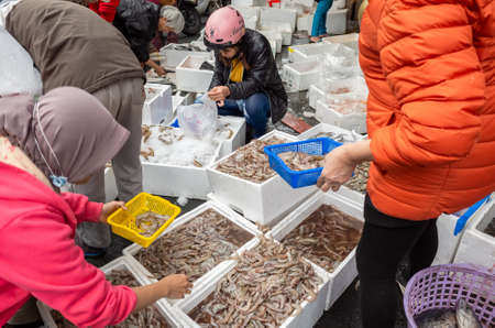Nantou, Taiwan - Jan 31, 2019: people buy fish at the traditional marketplace at Puli town, Nantou, Taiwan.のeditorial素材
