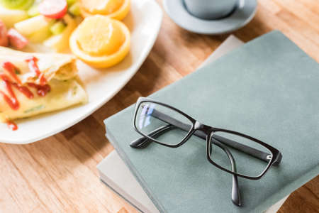 morning working with breakfast on table with nobodyの写真素材