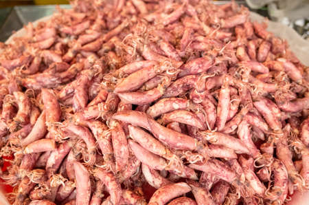 heap of dried squid fish at the traditional market at Taiwanの写真素材