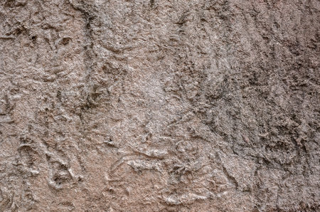 background of rough stone wall in brown color