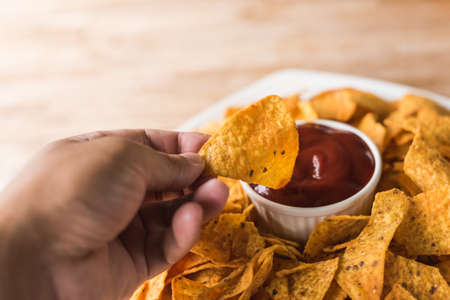 yellow mexican nachos chips on the tableの写真素材