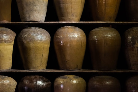 rows of fermented alcoholic beverage in the old pottery at Puli Brewery, Nantou, Taiwan