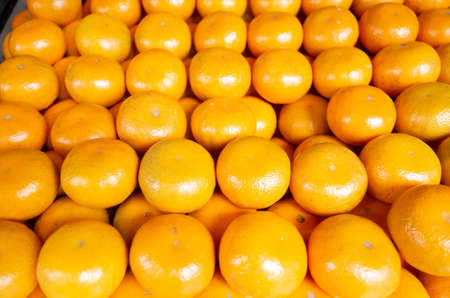 orange fruit stacked on the marketplace at Taiwanの写真素材