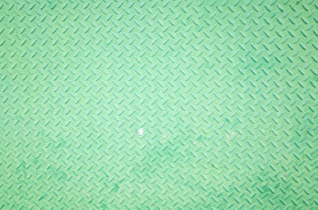 background of metal diamond plate in green colorの写真素材