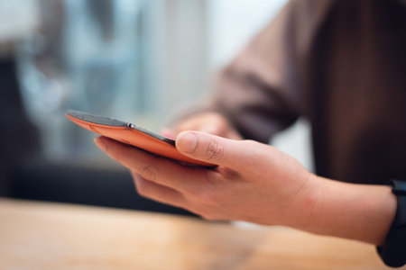 woman using cellphone and sit in a restaurant