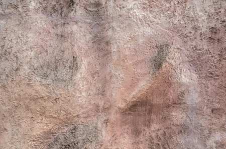 background of rough stone wall in brown colorの写真素材