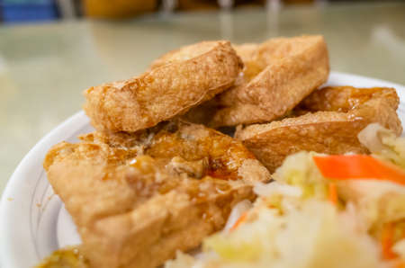 famous Taiwanese snack stinky tofu on the tableの写真素材