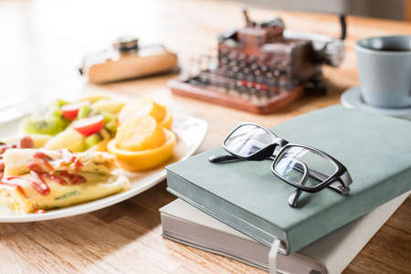 morning working with breakfast on table with nobodyの写真素材