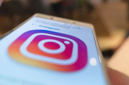 Taipei, Taiwan - May 12th, 2019:using social media at a smartphone in a restaurant in Taipei, Taiwan, Asiaのeditorial素材