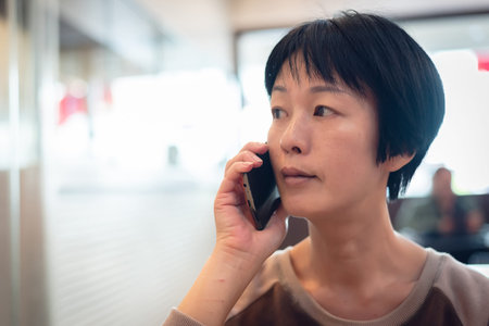woman talking on cellphone at a restaurant