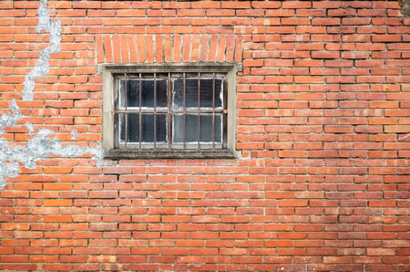 old window on red brick wall in the outdoor
