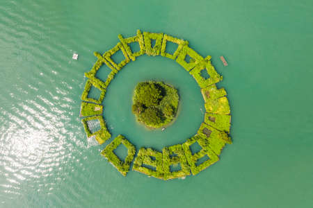 aerial view of a small island named "Lalu" at famous Sun Moon Lake landscape in Nantou, Taiwanの写真素材