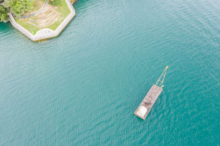 landscape of fishing boat over lake in aerial view at Sun Moon Lake, Nantou, Taiwanの写真素材