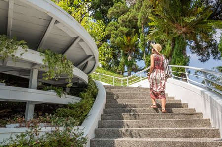 woman walking at a stairs in the Sun Moon Lake at Nantou, Taiwanの写真素材