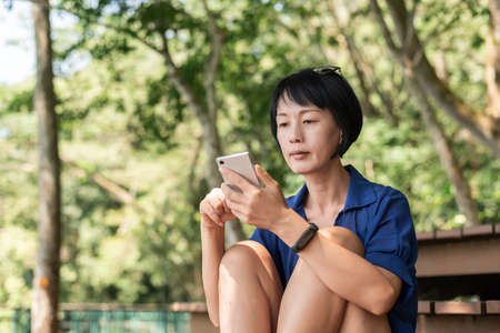woman using the smart phone, closeup imageの写真素材