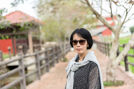 portrait of mature Asian woman in the outsideの写真素材