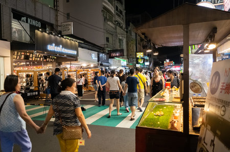 Chiayi, Taiwan - July 13th, 2019: people and stalls at Wenhua road night market, Chiayi County,...