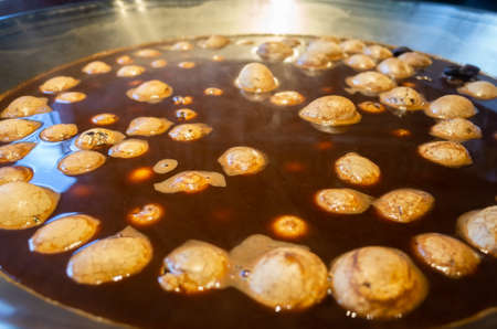 tea eggs, close-up shot of typical Chinese savory food commonly sold as a snack in Taiwanの写真素材